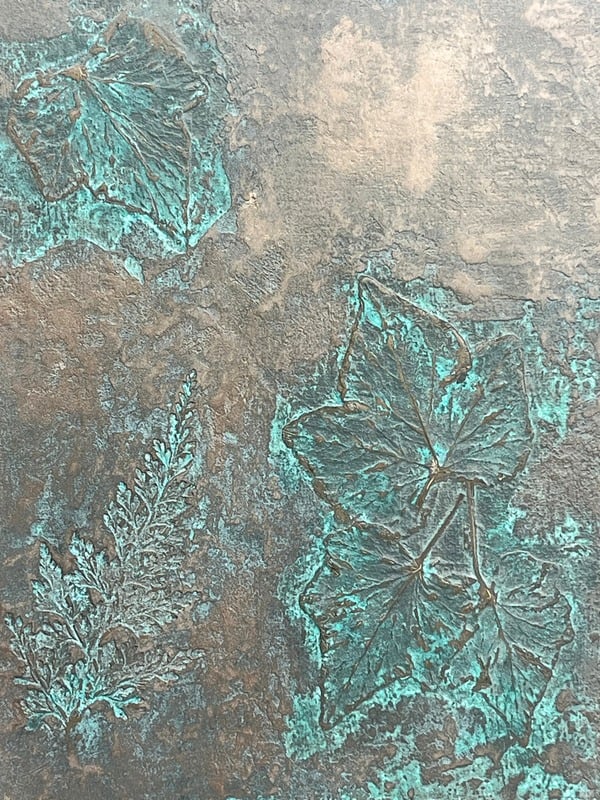 Aged bronze and green verdigris patina finish with botanical leaf texture, bespoke finish sample