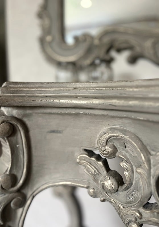 Silver liquid metal finish on ornate carved frame, bespoke finish detail