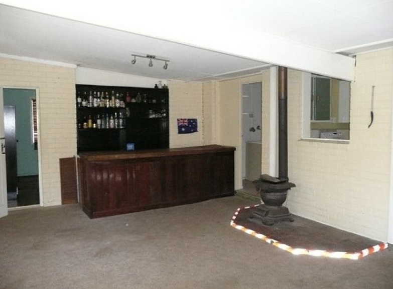 Outdated kitchen and bar area before renovation, Max project